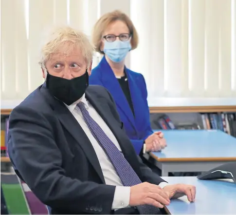  ??  ?? CONCERNED: Prime Minister Boris Johnson with Global Partnershi­p for Education chairwoman Julia Gillard during a visit to Cleves Cross Primary School in Ferryhill, County Durham.