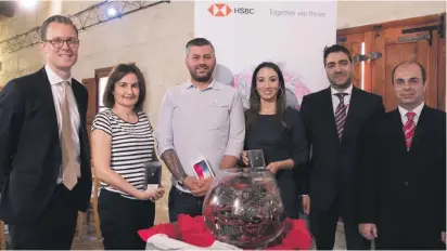  ??  ?? The HSBC Touch ID winners with HSBC officials