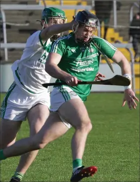  ??  ?? Naomh Eanna corner-back Eoin Conroy is pursued by Eoin Cody of Shamrocks.