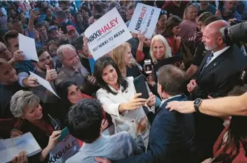  ?? WIN MCNAMEE/GETTY ?? Republican presidenti­al candidate Nikki Haley greets supporters after her first campaign event Wednesday in Charleston, S.C. Haley has plenty of accomplish­ments, including being the first female governor of South Carolina.