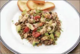  ?? MELISSA D’ARABIAN VIA AP ?? A lentil and salmon salad with smoky mustard dressing