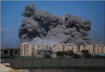  ?? ABDEL KAREEM HANA — THE ASSOCIATED PRESS ?? Smoke rises following an Israeli airstrike in the central Gaza Strip on Friday.