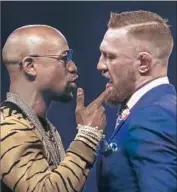  ?? Matthew Lewis Getty Images ?? FLOYD MAYWEATHER JR. stands to make an estimated $350 million for facing Conor McGregor.