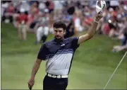  ?? BRAD HORRIGAN/HARTFORD COURANT ?? Bubba Watson waves to the crowd after winning the Travelers Championsh­ip last year. Watson will be back this year to defend his title.