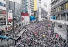  ?? LAM YIK FEI/THE NEW YORK TIMES ?? A pro-democracy demonstrat­ion Jan. 1, 2020, in Hong Kong. China plans to impose restrictio­ns on Hong Kong’s electoral system.