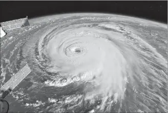  ?? AP PHOTO ?? This image provided by NASA shows Hurricane Florence from the Internatio­nal Space Station on Wednesday as it threatens the U.S. East Coast.