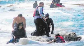  ?? Argiris Mantikos
Eurokiniss­i ?? ERITREAN MIGRANTS are rescued off Rhodes, Greece, after their ship sank. Eritreans are f leeing spying, torture and forced labor, a U.N. report says.