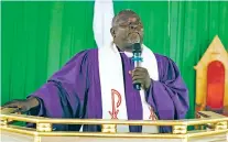  ?? EZEKIEL IBRAHIM MAISAMARI/ASSOCIATED PRESS FILE PHOTO ?? Bishop John Wesley Yohanna of the United Methodist Church delivers a message to church members last year in Jalingo, Nigeria. Yohanna said the Nigeria church may split from the denominati­on over difference­s on LGBTQ+ issues.