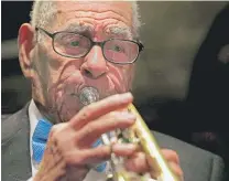  ?? | GERALD HERBERT/AP ?? Jazz musician Lionel Ferbos performs at his 102nd birthday party in July 2013 at the Palm Court Jazz Cafe in New Orleans.