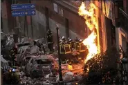  ?? MANU FERNANDEZ — THE ASSOCIATED PRESS ?? Fire-fighters carry a dead body next to a damaged building at Toledo Street following an explosion in downtown Madrid, Spain, Wednesday, Jan. 20.