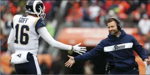  ?? PHOTO/JOE MAHONEY ?? Los Angeles Rams head coach Sean McVay celebrates with quarterbac­k Jared Go (16) after a touchdown during the first half of an NFL football game against the Denver Broncos, on Sunday, in Denver. AP