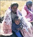  ?? ?? P h i l i l e V i l a k a t i w a s accompanie­d by her son to receive her blanket.