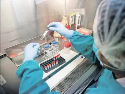  ?? Photo: Mariana Bazo/Reuters ?? Solutions: A health technician analyses blood samples for tuberculos­is testing in a high-tech TB lab in Lima, Peru. South Africa will soon have the GeneXpert Omni (below), which means diagnosis and treatment will be immediate, improving the lives of...