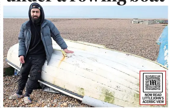  ?? ?? Sea view: Syrian Alaa Eldin, 25, next to the small boat on Dover beach, under which he sleeps, wants to go back to France