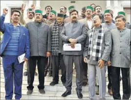  ?? SHYAM SHARMA/HT ?? Former CM Virbhadra Singh, opposition leader Mukesh Agnihotri along with other congress MLAs after staging a walkout from the House in Dharamshal­a on Wednesday.