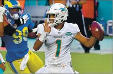  ?? MARK BROWN — GETTY IMAGES ?? Miami’s Tua Tagovailoa won his first NFL start against the Rams last week, and the Dolphins hope he’s on his way to becoming a franchise quarterbac­k.