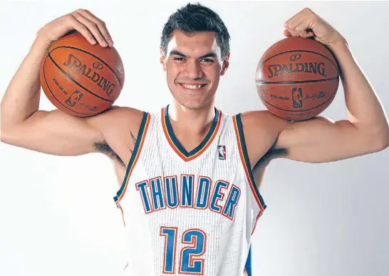  ?? Photo: LAYNE MURDOCH/NBAE VIA GETTY IMAGES ?? Big guns: Kiwi first-round draft pick Steven Adams wearing his new Oklahoma City Thunder strip. Sales of basketball gear are expected to get a boost with his draft.