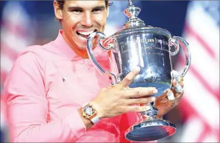 ?? AFP ?? Rafael Nadal poses with the trophy after beating Kevin Anderson in the 2017 US Open men’s singles final at the USTA Billie Jean King National Tennis Center in New York on Sunday.