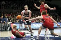  ?? JEFF CHIU — THE ASSOCIATED PRESS ?? Gonzaga forward Drew Timme drives to the basket between Saint Mary’s forward Matthias Tass, bottom, forward Kyle Bowen (14) and guard Alex Ducas (44) during the first half of game this past weekend.