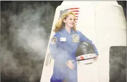  ??  ?? Eva Gudet emerges from the capsule during Columbus Magnet School’s annual Young Astronauts Mission Landing event Friday.
