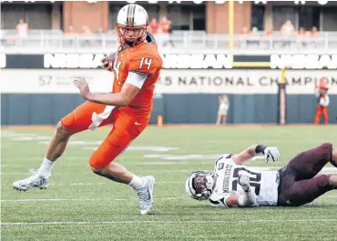  ?? [PHOTO BY NATE BILLINGS, THE OKLAHOMAN] ?? Oklahoma State’s Taylor Cornelius (14) leaves behind Missouri State’s Jared Beshore on a run that ended shy of the end zone.