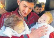  ??  ?? Not another one: AbdulHamid Alyousef holds his twin babies who were killed during a suspected chemical weapons attack in Syria’s Khan Sheikhoun in April. AP FILE