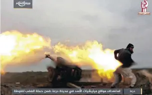  ??  ?? This photo by the Syrian insurgent group Army of Islam, purports to show its fighters firing artillery during clashes with government forces in the southern province of Daraa, Syria. Picture: AP