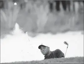  ?? Tannen Maury EPA/Shuttersto­ck ?? HAROLD VARNER III blasts out of a bunker on the 12th hole at the PGA Championsh­ip, where an 11-over-par 81 led to a fall from second place to a tie for 36th.