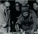  ?? AP ?? Cuban revolution­ary leader Fidel Castro signs the instrument of office to become the island nation’s prime minister on Feb. 16, 1959.