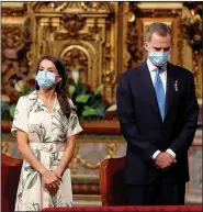  ??  ?? MASKED: Spain’s touring rulers Letizia and Felipe at a mass in Galicia yesterday