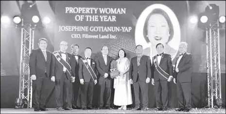  ?? ?? Josephine Gotianun Yap (6th from left), president and CEO of Filinvest Developmen­t Corp. and CEO of Filinvest Land Inc. is named FIABCI’s Property Woman of the Year. She is seen accepting the award from FIABCI officials and guest of honor Sen. Joseph Victor Ejercito (7th from left), accompanie­d by former ambassador to Singapore Joseph Del Mar Yap (5th from left)) and Filinvest Land Inc. president Tristan Las Marias (left).
