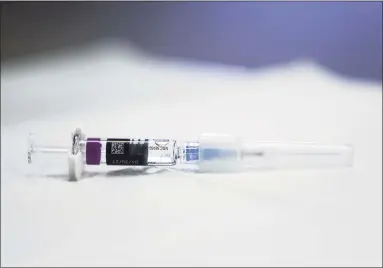  ?? Mario Tama / Getty Images ?? A flu vaccine syringe rests on a table. Connecticu­t’s flu season has been unusually quiet compared to previous years.