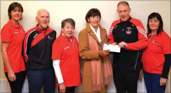  ??  ?? Liz Galwey (lefty) with Donal O’Connor, Síle Kenny, Catherine Horan of Castleisla­nd fundraisin­g branch of Kerry Hospice Foundation accepting a cheque from St. Mary’s Basketball Club Chairman Eamon Egan last November, and Joan Nolan