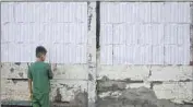  ?? Associated Press ?? VOTER ROLLS line a wall in Managua as municipali­ties across Nicaragua hold elections on Sunday.