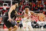  ?? Greg Fiume / Getty Images ?? Jahmir Young, right, drives against Northweste­rn’s Boo Buie during the second half of Maryland’s 75-59 win.