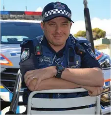  ?? Photo: Michael Doyle ?? SAVING LIVES: Constable Chris Metcalf has been hailed a hero by peers after rescuing a man from Myall Creek in Dalby.