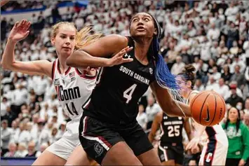  ?? Jessica Hill/associated Press ?? South Carolina’s Aliyah Boston (4) was honored for the third straight year as an All-american by The Associated Press on Wednesday.