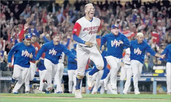  ?? Chris Carlson Associated Press ?? THE INTERNATIO­NAL tiebreaker enlivened the World Baseball Classic; just ask Carlos Correa and Puerto Rico. MLB could try it to address issue of overlong games.