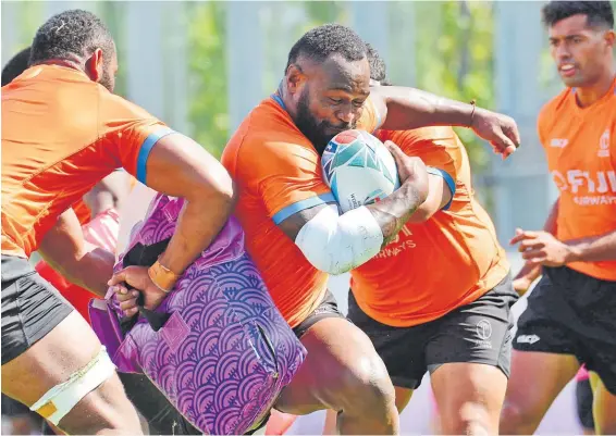  ?? Picture: JOVESA NAISUA ?? Flying Fijians centre Levani Botia powers through during defence training at the Red Hurricanes Training Ground in Osaka, Japan yesterday.