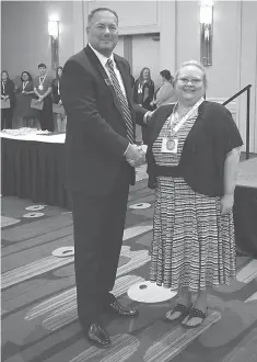  ?? Submitted photo ?? ■ Steve Cole, Arkansas Community College board president, presents Brandy Flowers with the 2018 Academic All-Star award. Flowers is pursuing an Associate of Applied Science degree with a focus in accounting and hopes to one day teach business at a community college.