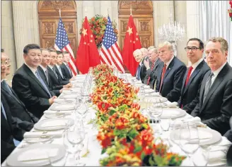  ?? AP PHOTO ?? President Donald Trump with China’s President Xi Jinping and members of their official delegation­s during their bilateral meeting at the G20 Summit, Saturday, in Buenos Aires, Argentina.