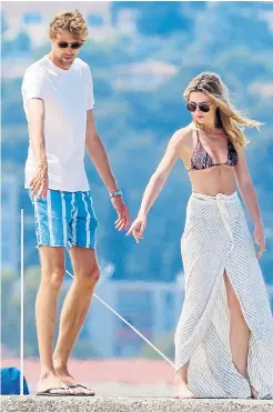  ??  ?? Peter Crouch and wife Abbey, above and left, soak up the sun