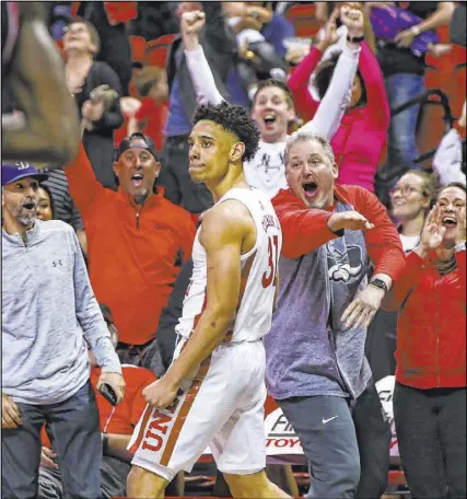  ?? Chase Stevens Las Vegas Review-Journal @csstevensp­hoto ?? UNLV guard Marvin Coleman struts after banking in a winning 15-foot shot with 0.08 seconds left as the Rebels beat Fresno State 68-67 in a Mountain West game Saturday at the Thomas & Mack Center.