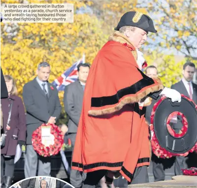  ??  ?? A large crowd gathered in Burton yesterday as a parade, church service and wreath-laying honoured those who died fighting for their country