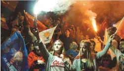  ??  ?? AK Party supporters celebrate outside the party's headquarte­rs on Sunday.