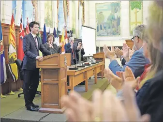  ?? CP PHOTO ?? Prime Minister Justin Trudeau receives a standing ovation at the National Caucus meeting on Parliament Hill.