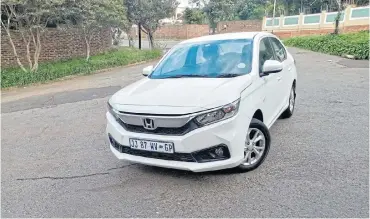  ??  ?? The front styling that is shared with larger Hondas makes it stands out in a crowd. Below: A decently sized boot should easily fit average family luggage without fuss. Below left: Simple, straightfo­rward layout is bolstered by attractive seat covers.