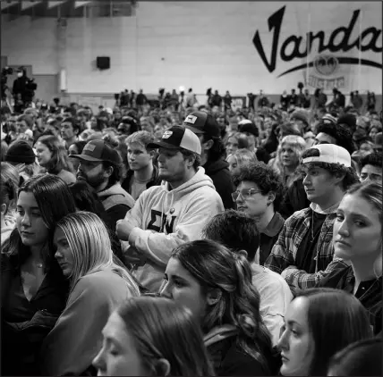  ?? TED S. WARREN / ASSOCIATED PRESS (2022) ?? People attend a vigil on Nov. 30 in Moscow, Idaho, for four University of Idaho students who were killed 17 days earlier. The suspected killer remains in custody.