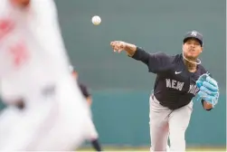  ?? GERALD HERBERT/AP ?? Yankees starting pitcher Marcus Stroman throws in the first inning of a spring training game against the Orioles on March 2 in Sarasota, Florida.