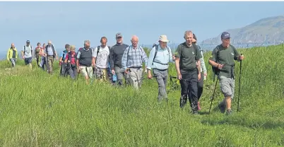  ??  ?? Walkers team up in support of the 12-day trek along the Southern Upland Way to raise money for RSABI